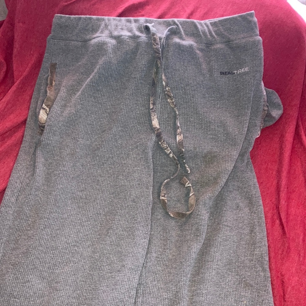 a size m realtree pants they are a light grey and camouflage